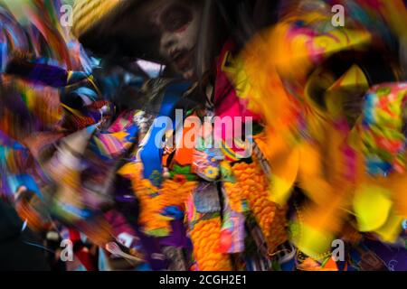 A Mexican woman, dressed in a colorful La Catrina costume, performs during the Day of the Dead celebrations in Oaxaca, Mexico. Stock Photo