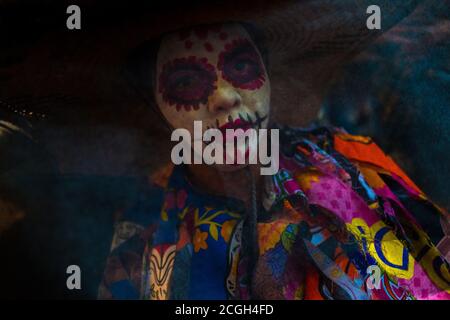 A Mexican woman, dressed as La Catrina, takes part in the Day of the Dead celebrations in Oaxaca, Mexico. Stock Photo
