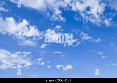 Blue sky background with tiny clouds. Stock Photo