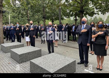 New York, United States. 11th Sep, 2020. Vice President Mike Pence (R), former New York Mayor Michael Bloomberg (C) and Democratic candidate for president Joe Biden (L) observe a moment during commemoration event at the 9/11 Memorial in Lower Manhattan near One World Trade Center in New York on Friday, September 11, 2020. This is the 19th anniversary of the 9/11 terrorist attacks on New York, Washington, DC and Shanksville, Pennsylvania. Pool Photo by Maggie Haberman/UPI Credit: UPI/Alamy Live News Stock Photo