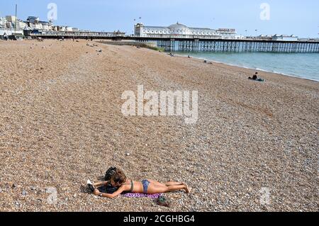 Brighton UK 11th September 2020 - A quiet part of Brighton Beach to sunbathe on a sunny day as the forecast is for hot weather to sweep across Britain over the weekend and next week : Credit Simon Dack / Alamy Live News Stock Photo