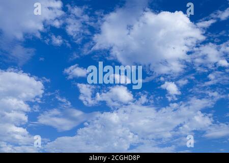 Blue sky background with tiny clouds. Stock Photo