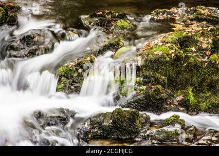A small cascade in a stream in the Lake District near Consiton Water. Stock Photo