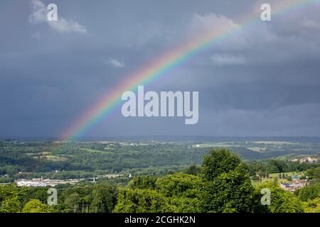 Rainbow over the Mohawk Valley leads to the former Beechnut facility in Canajoharie, New York. Stock Photo