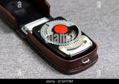Old vintage Soviet retro exposure meter (a device for measuring photographic exposure and determining the correct shutter speed and aperture). Stock Photo
