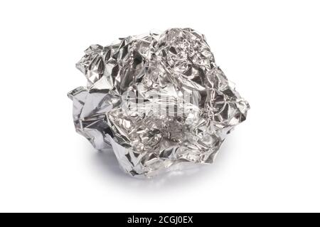 Studio shot of crumpled alluvium foil cut out against a white background - John Gollop Stock Photo