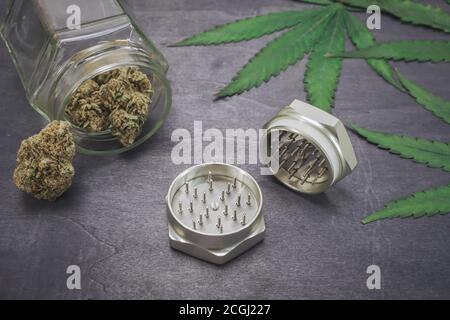 CBD medical marijuana buds on black wood background. Organic and natural hemp-based cosmetic and beauty products. Medical cannabis concept. Stock Photo