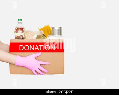 Food donations in hands isolated on white background Stock Photo - Alamy