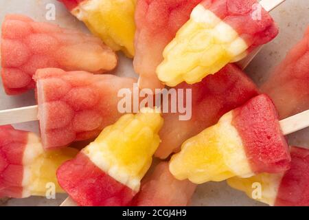 Mixed fruit ice lolly made - pineapple and watermelon Stock Photo
