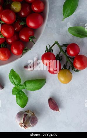Cherry tomatoes with basil and garlic Stock Photo