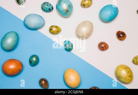 Blue colored Easter eggs with gold elements on a blue and white background, diagonal. Happy Easter! Stock Photo