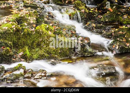 A small cascade in a stream in the Lake District near Coniston Water. Stock Photo