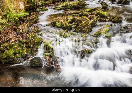 A small cascade in a stream in the Lake District near Coniston Water. Stock Photo