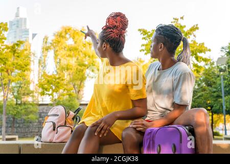 A travelling couple discovering the city on a summer day. Stock Photo