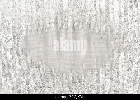 Unique funny frame of an old towel with worn textiles. Fabric background. Macro. Stock Photo
