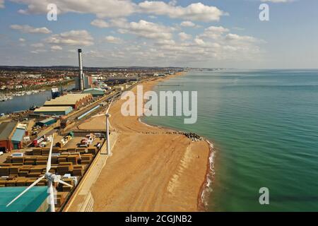 Looking from Southwick beach with Wind Turbines and Shoreham Power Station in view. Stock Photo