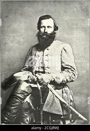 . The photographic history of the Civil War : in ten volumes . MAJOR-GENERAL JAMES EWELL BROWN STUART, C.S. A. In the hat on General Stuarts knee appears the plume which grew to symbolize the dash and gallantry of theman himself. Plume and hat were captured, and Stuart himself narrowly escaped, at Verdiersville, August 17,1862. I intend, he wrote, to make the Yankees pay for that hat. Less than a week later he capturedPopes personal baggage and horses, and for many days thereafter the Federal generals uniform was on exhibitionin a Richmond store window—a picturesque and characteristic reprisal Stock Photo