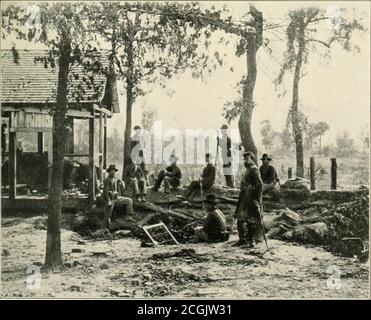 . The photographic history of the Civil War : thousands of scenes photographed 1861-65, with text by many special authorities . *ior pub co. VIRGINIA—FEDERAL PICKET STATION NEAR ISII.L RUN, 1SG2. GEORGIA—PICKETS JUST BEFORE THE BATTLE OF ATLANTA, JULY 2*2, 1861 regular sentinels are onduty with keenly observanteyes. When their tour ofduty has been completedthey will be relieved bysome of the men who are somuch at ease. The picketsretreated before any ad-vance in face of the Con-federates, and rejoined themain body of troops. Inthe Atlanta photograph,the reserve post isslightly in the rear of t Stock Photo