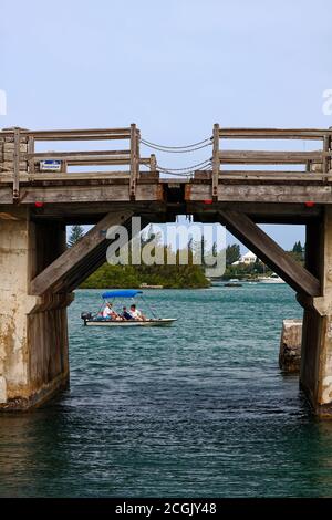 Somerset Bridge; 22' wide; world's smallest drawbridge; hinged wood; sid view; boat; people, water, marine scene, Ely's Harbour; Somerset Island; Berm Stock Photo