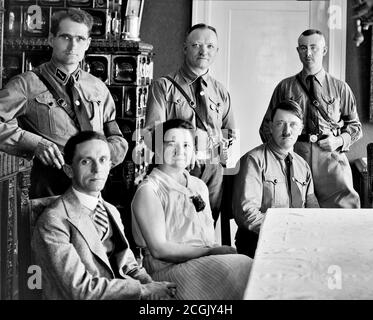 Senior nazi party figures. Standing, left to right: Rudolf Hess, Martin Mutschmann (?), Heinrich Himmler (?). Seated, left to right: Joseph Goebbels, ?, Adolf Hitler. Stock Photo