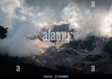 Mountain peak shrouded in thick fog Stock Photo - Alamy