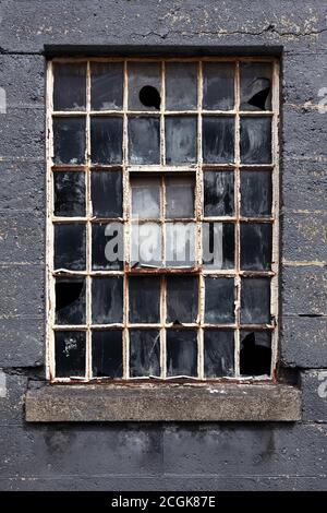 Old broken multi pane crittall window Stock Photo