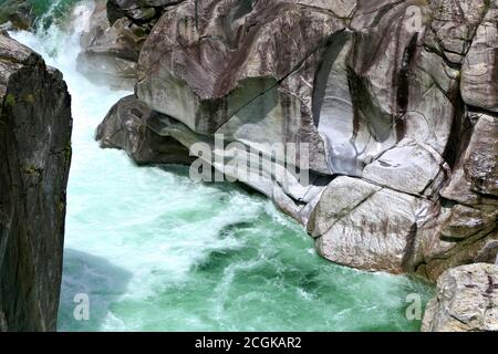 Closeup of the green Verzasca River and abraded rocks in Valle Verzasca valley in the Locarno district of the Canton of Ticino in Switzerland Stock Photo