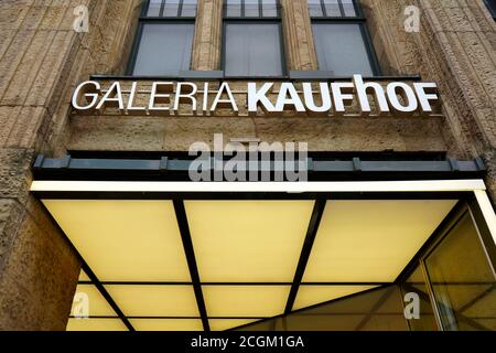 Logo at the entrance of the department store 'Galeria Kaufhof' at Königsallee in Düsseldorf. Galeria Kaufhof is a German department store chain. Stock Photo