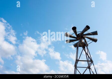 Old multidirectional emergency siren attached to a steel pylon. Concepts of urgent crisis communication, alarm and danger Stock Photo