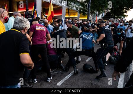 Madrid, Spain. 11th Sep, 2020. Police trying to detain a supporter of far right wing during a protest against the Blanquerna case coinciding with the celebration of the 'Diada' National Day in Catalonia. Credit: Marcos del Mazo/Alamy Live News Stock Photo