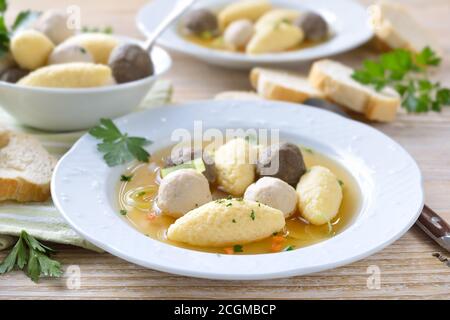 Delicious wedding soup consisting  of a strong meat broth with various small dumplings Stock Photo