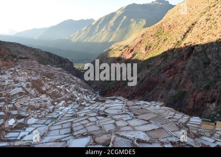 A mesmerizing view of the salt terraces in Maras, Peru famous. These Salt Ponds in South America were built in AD200-AD900 by the Chanapata culture Stock Photo
