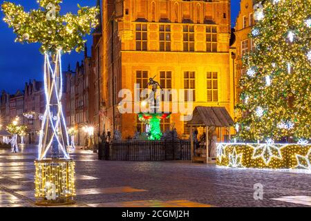 Christmas Long Market Street with Fountain of Neptune at night in Old Town of Gdansk, Poland Stock Photo