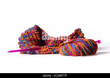 Colourful woolen cloth, needle and skein isolated on white Stock Photo