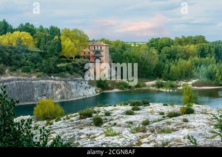 View from the Pont du Gard bridge over the Gardon or Gard river in Languedoc-Roussillon, southern France. Its source is in the commune of Saint-Martin Stock Photo