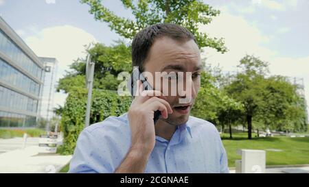 Businessman is having a difficult communication talking on the p Stock Photo
