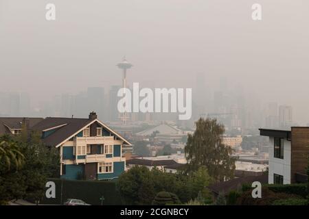 Seattle, USA. 11th Sep, 2020. The normally scenic city skyline now blanketed with a plume of Wildfire smoke covering the Pacific Northwest. Seattleites are adjusting to a new normal of smokey summers. Wildfires rage yearly now causing a dramatic drop in air quality from the normally crisp clean Washington air. Credit: James Anderson/Alamy Live News Stock Photo