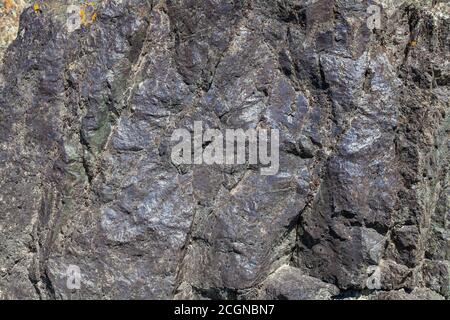 Close-up texture of the stone, sanded and smooth gray with a purple tint. Background for wallpaper, post or illustrations in social networks. Stock Photo