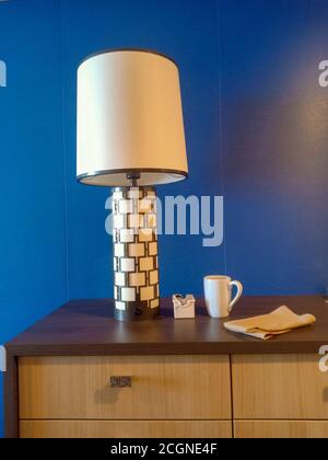 table light coffee cup and a napkin on a table Stock Photo
