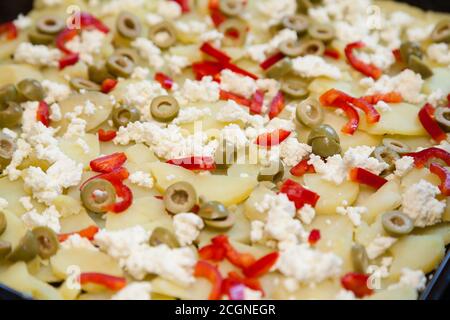Closeup of potatoes with red pepper and olives Stock Photo