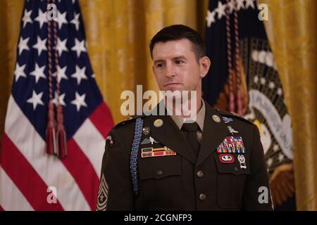 Sergeant Major Thomas Payne, United States Army, waits to accept the Medal of Honor from US President Donald Trump during a ceremony in the East Room of the White House in Washington, DC on September 11, 2020. Payne is the 1st living Delta Force member to receive the Medal of Honor. Credit: Chris Kleponis/Pool via CNP /MediaPunch Stock Photo