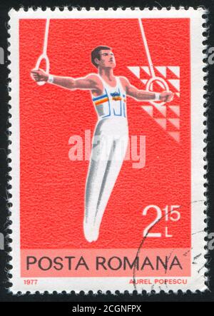 ROMANIA CIRCA 1977 Stamp Printed By Romania Shows Woman Spinning ROMANIA CIRCA 1977 Stamp Printed By Romania Shows Woman Spinning