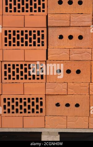 Clay brown bricks on construction market. Stock Photo