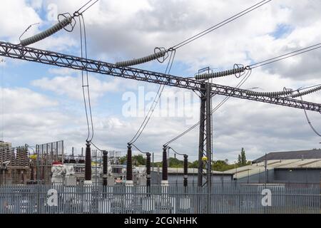 High voltage electrical cables and insulators in a power substation Stock Photo