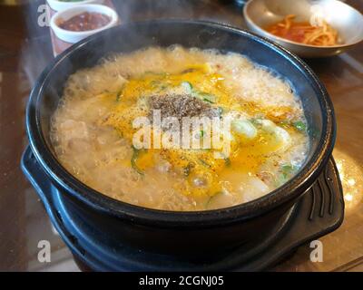 Soondae Gukbap, made by putting cooked rice into hot soup with Korean blood sausage made by steaming pig intestines stuffed with various ingredients. Stock Photo