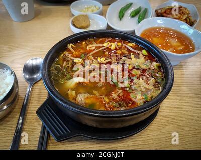 Haejang-guk, or Hangover soup - soup eaten as a hangover cure in Korean cuisine. Sliced congealed ox blood similar to black pudding in a beef broth. Stock Photo