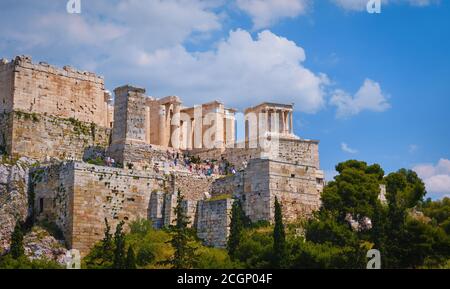 View of Acropolis hill from Areopagus hill in summer day with great clouds in blue sky, Athens, Greece. UNESCO heritage. Propylaea gate, Parthenon. Stock Photo