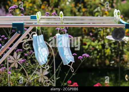 Washed mouth nose protection on clothesline Stock Photo