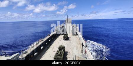 U.S. Army High Mobility Artillery Rocket Systems from the 17th Field Artillery Brigade travel from Guam to Palau on the logistic support vessel LTG William B. Bunker (LSV-4), Sept. 5. The 8th Theater Sustainment Command used LSV-4 to practice force projection and expeditionary sustainment as part of Defender Pacific 20, a joint exercise that demonstrates strategic readiness by deploying combat credible forces across the Indo-Pacific Theater of operations. 'The LSVs provide critical movement and maneuver capabilities in support of the joint force,' said Maj. Gen. David Wilson, commanding genera Stock Photo