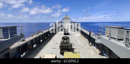 U.S. Army High Mobility Artillery Rocket Systems from the 17th Field Artillery Brigade travel from Guam to Palau on the logistic support vessel LTG William B. Bunker (LSV-4), Sept. 5. The 8th Theater Sustainment Command used LSV-4 to practice force projection and expeditionary sustainment as part of Defender Pacific 20, a joint exercise that demonstrates strategic readiness by deploying combat credible forces across the Indo-Pacific Theater of operations. 'The LSVs provide critical movement and maneuver capabilities in support of the joint force,' said Maj. Gen. David Wilson, commanding genera Stock Photo